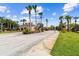 Welcome to Fiesta Key, a beautiful community with lush landscaping, palm trees, and inviting architecture at 1180 S Beach Cir, Kissimmee, FL 34746