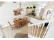 Open-concept living and dining area with tile flooring, and breakfast bar at 1180 S Beach Cir, Kissimmee, FL 34746