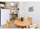Cozy dining area with seating for four adjacent to the kitchen at 1180 S Beach Cir, Kissimmee, FL 34746