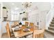 Bright dining room with a view into the kitchen and staircase at 1180 S Beach Cir, Kissimmee, FL 34746