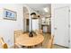 Cozy dining area with seating for four adjacent to the kitchen at 1180 S Beach Cir, Kissimmee, FL 34746