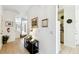 Inviting foyer with tiled flooring, neutral walls, and a view into the living area and staircase at 1180 S Beach Cir, Kissimmee, FL 34746