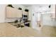 Well-lit kitchen with stainless steel appliances, light wood cabinets, and a view to the dining nook at 1180 S Beach Cir, Kissimmee, FL 34746