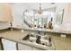 Kitchen sink and counter view looking out to the dining and living area at 1180 S Beach Cir, Kissimmee, FL 34746