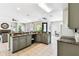 Large kitchen with granite countertops, stainless appliances, and ample cabinet space at 1180 S Beach Cir, Kissimmee, FL 34746