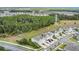 Aerial view of the community showcasing well-maintained townhomes, lush greenery, and convenient street access at 12307 Turtle Grass Dr, Orlando, FL 32824