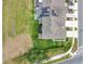 Aerial view of the property featuring a well-maintained lawn and solar panels on the roof at 12307 Turtle Grass Dr, Orlando, FL 32824