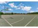 Community basketball court with well-maintained surfaces and hoops, perfect for recreational games and exercise at 12307 Turtle Grass Dr, Orlando, FL 32824