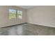 Bright, spacious bedroom with tile flooring and large windows offering ample natural light at 12307 Turtle Grass Dr, Orlando, FL 32824