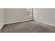 Bedroom with soft carpeting and a bright window at 12307 Turtle Grass Dr, Orlando, FL 32824