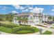 Charming townhome exterior featuring lush landscaping, well-maintained lawn, and private garage at 12307 Turtle Grass Dr, Orlando, FL 32824