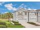 Charming two-story townhome with well-maintained landscaping and attached one car garage at 12307 Turtle Grass Dr, Orlando, FL 32824