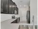 Modern kitchen boasts dark cabinets, stainless steel appliances, and bright white subway tile backsplash at 12307 Turtle Grass Dr, Orlando, FL 32824