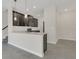 Eat-in kitchen features modern design with stainless steel appliances and a breakfast bar at 12307 Turtle Grass Dr, Orlando, FL 32824
