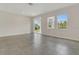 Spacious living area featuring tile flooring, natural light, and seamless indoor/outdoor flow at 12307 Turtle Grass Dr, Orlando, FL 32824