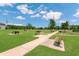 Community park with walking paths, picnic tables, and benches, offering residents a relaxing and scenic outdoor space at 12307 Turtle Grass Dr, Orlando, FL 32824