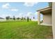 Expansive backyard offers ample lawn space for outdoor living, landscaping, and recreation at 1247 Blue Daze Ln, Eustis, FL 32726