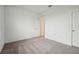 An empty bedroom with carpet floors and neutral paint ready for your design at 1247 Blue Daze Ln, Eustis, FL 32726