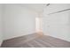 Empty bedroom with carpet floors and neutral paint with a double door closet at 1247 Blue Daze Ln, Eustis, FL 32726