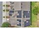 Overhead shot of townhome roofs with solar panels, landscaping, and paved driveways at 1262 E 10Th St, Apopka, FL 32703