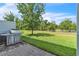 Spacious backyard with stainless steel grill and landscaped lawn at 1262 E 10Th St, Apopka, FL 32703