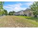 View of townhome backyards, showing private patios and green spaces at 1262 E 10Th St, Apopka, FL 32703