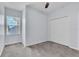 Bedroom with a window, double door closet, and carpeted floor at 1262 E 10Th St, Apopka, FL 32703