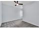 Bright bedroom with a ceiling fan, carpeted floor and blank walls at 1262 E 10Th St, Apopka, FL 32703