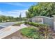 A welcoming entrance sign for Ambergate, adorned with lush greenery and landscaping, under a clear sky at 1262 E 10Th St, Apopka, FL 32703