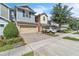 Well-maintained townhome with a brick paver driveway and a lush, green lawn at 1262 E 10Th St, Apopka, FL 32703