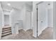 Upstairs hallway with neutral carpet, white trim, and access to bedrooms at 1262 E 10Th St, Apopka, FL 32703