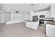 Open-concept kitchen with stainless steel appliances and a granite-topped island at 1262 E 10Th St, Apopka, FL 32703