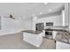 Open kitchen featuring granite countertops, stainless steel appliances and tile floors at 1262 E 10Th St, Apopka, FL 32703
