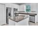 Bright kitchen features granite countertops, stainless steel appliances, and a kitchen island at 1262 E 10Th St, Apopka, FL 32703