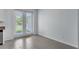Bright kitchen area with tile floors, white cabinets, and access to the outdoor patio at 1262 E 10Th St, Apopka, FL 32703