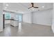 Open-concept living space with tile flooring and direct access to the modern kitchen at 1262 E 10Th St, Apopka, FL 32703