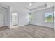 Main bedroom with carpet, tray ceiling, and two windows for natural light at 1262 E 10Th St, Apopka, FL 32703