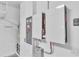 Tesla Powerwall system installed in garage with gray electrical box and backup power interface at 1262 E 10Th St, Apopka, FL 32703