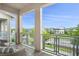 Charming balcony showcasing neighborhood views and comfortable seating, perfect for relaxing at 13437 Granger Ave, Orlando, FL 32827