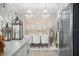 Open dining room with modern chandeliers, decor and seating for six at 13437 Granger Ave, Orlando, FL 32827
