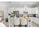 Well-lit kitchen featuring ample counter space, an island and stainless appliances at 13437 Granger Ave, Orlando, FL 32827
