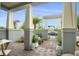 Covered patio area with tile flooring, seating, decor, and greenery at 13437 Granger Ave, Orlando, FL 32827