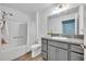 Bathroom featuring a tub and shower combination, vanity, and granite countertop at 1397 Gatlin Pl, The Villages, FL 32163