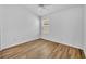 Bright bedroom featuring wood flooring and a window with blind coverings at 1397 Gatlin Pl, The Villages, FL 32163