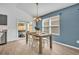 Dining room table set with an outside view of the hot tub at 1397 Gatlin Pl, The Villages, FL 32163