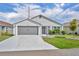 Charming single-story home with well-maintained landscaping and a two-car garage at 1397 Gatlin Pl, The Villages, FL 32163