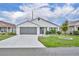 Charming single-story home with well-maintained landscaping and a two-car garage at 1397 Gatlin Pl, The Villages, FL 32163