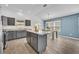 Kitchen island showing the countertops and dining area at 1397 Gatlin Pl, The Villages, FL 32163