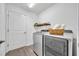 Well-lit laundry room with modern washer and dryer at 1397 Gatlin Pl, The Villages, FL 32163