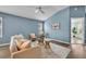 Cozy living room with vaulted ceilings, perfect for relaxation at 1397 Gatlin Pl, The Villages, FL 32163